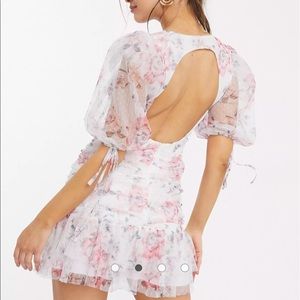 ASOS DESIGN ruched dobby bodycon mini dress with pep hem in floral print